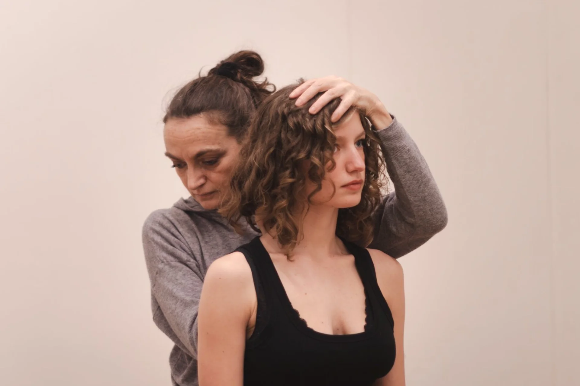 Giulia with hand on head of client